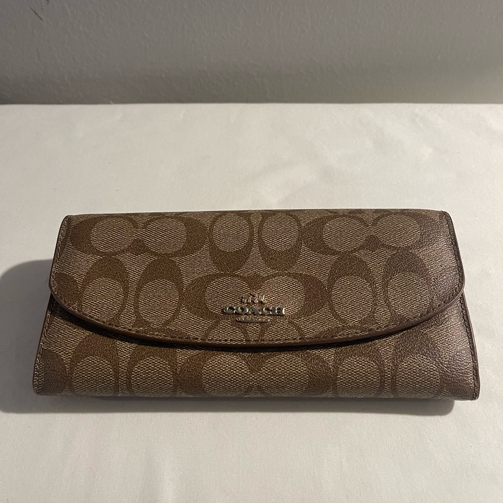 Coach Signature Brown Leather Wallet.